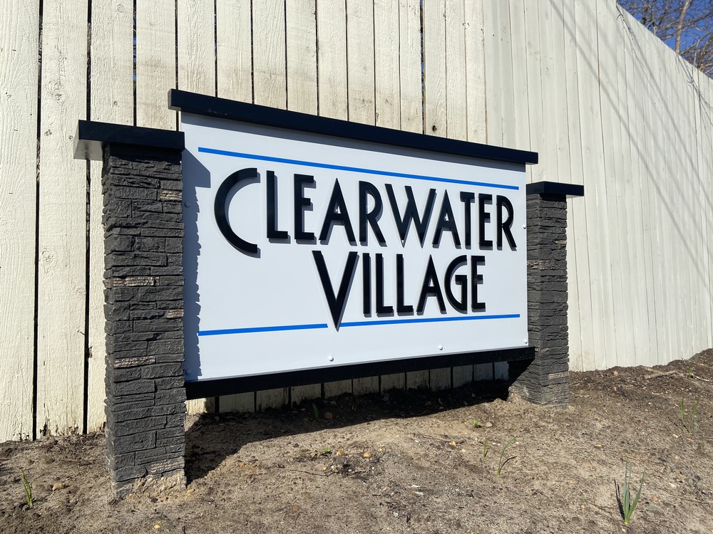 Clearwater Village sign up against wall